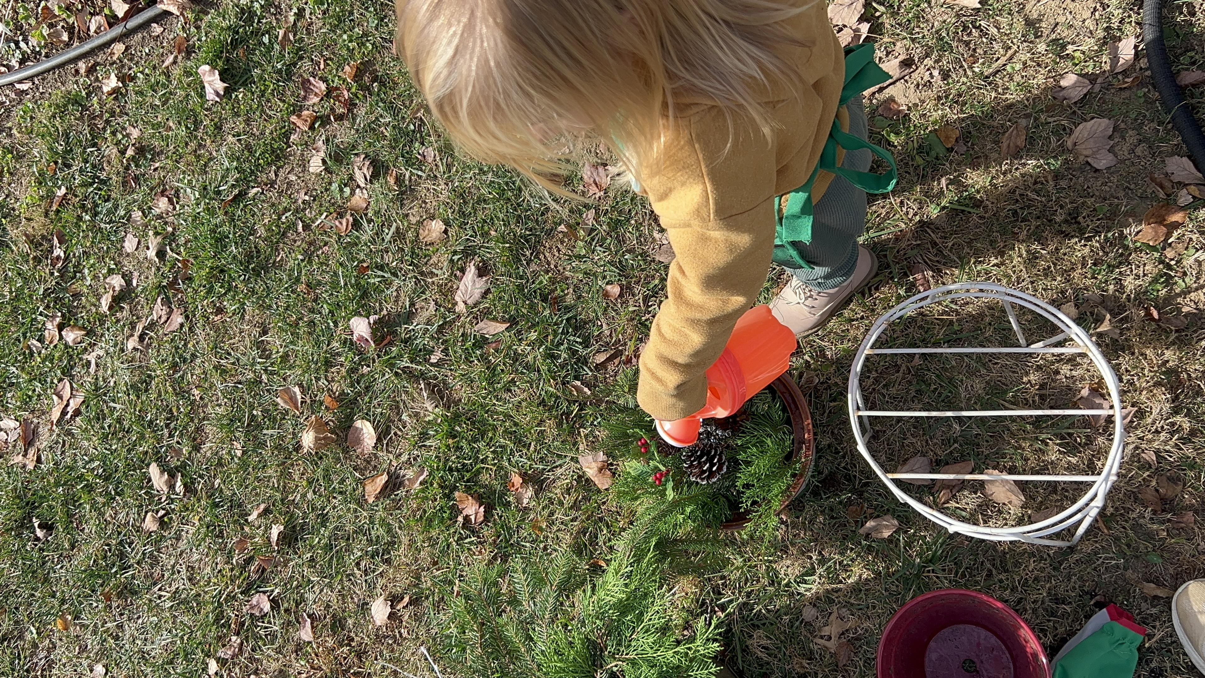 toddler watering winter porch pot