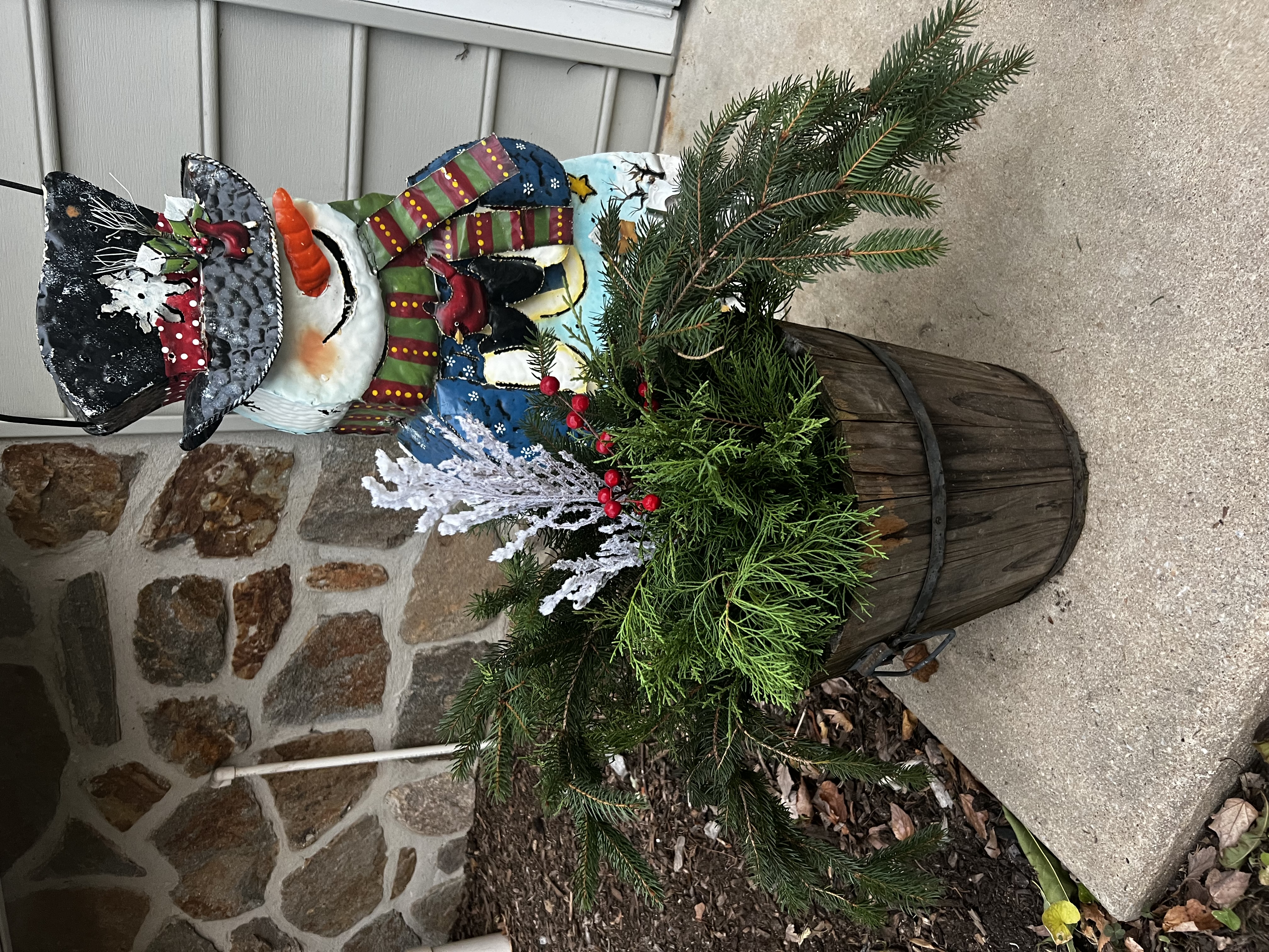 winter porch pot planter with evergreen holly and pine