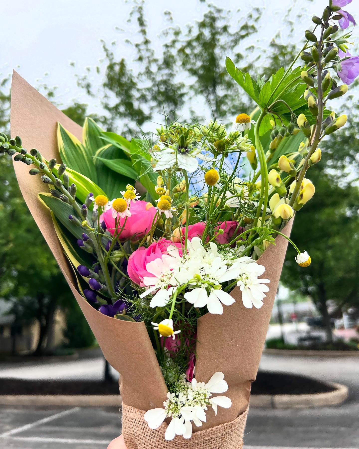 Mixed bouquet of local flowers wrapped